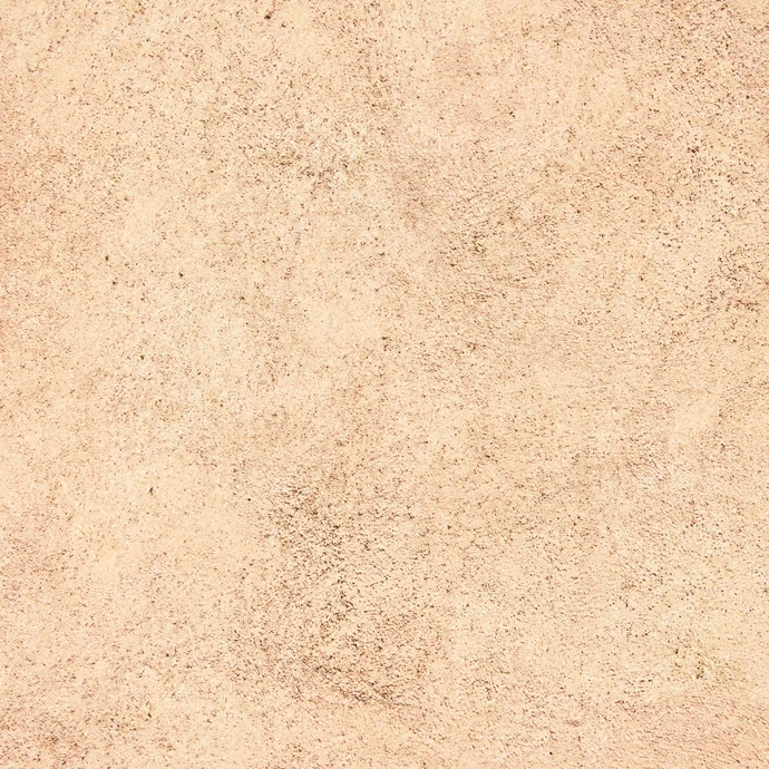 Surface de béton brut de couleur beige clair avec texture granuleuse uniforme